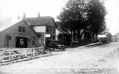 028 myers collection forestport ny view of main street and garage from river
