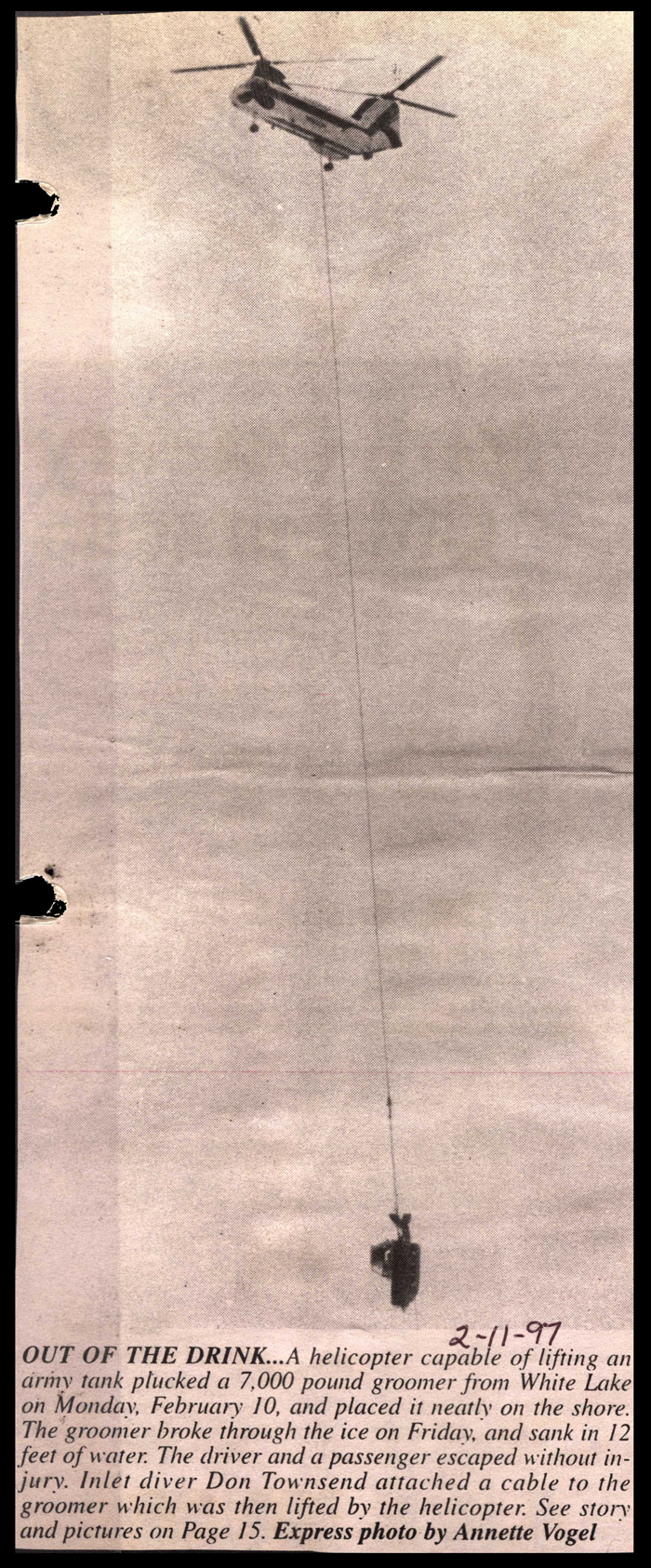 helicopter lifts trackside blazers snow groomer from white lake february 11 1997